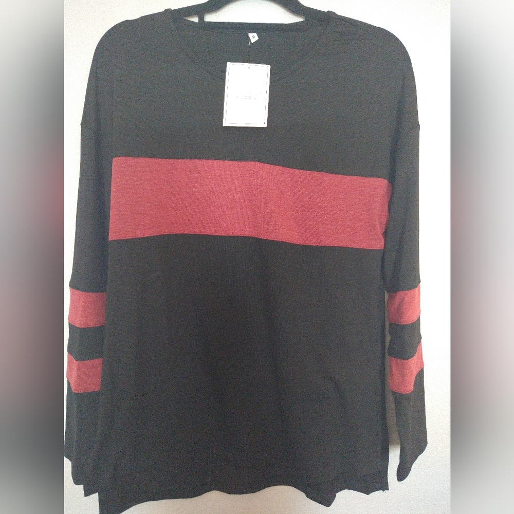 Women's black tunic with split side, new with tags. Size M.